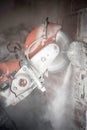 construction worker cutting concrete with a professional concrete chainsaw Royalty Free Stock Photo