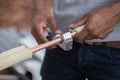 Worker cutting copper pipe of air conditioner Royalty Free Stock Photo