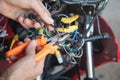 Worker cutting electrical wires with pliers Royalty Free Stock Photo