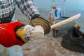 Worker cutting flooring tile with an diamond electric saw blade a construction site Royalty Free Stock Photo