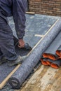 Worker cutting insulation material for basement wall 4