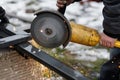 Worker cutting metal with angle grinder machine for welding iron. Close up of circular grinder disc and electric sparks. Workers Royalty Free Stock Photo