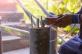 Worker cutting metal with grinder. Sparks while grinding iron. Electric wheel grinding on steel structure in factory. Sparks from Royalty Free Stock Photo