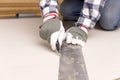 Worker cutting plasterboard with construction knife. Attic renov Royalty Free Stock Photo