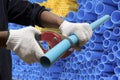 Worker cutting pvc pipe Royalty Free Stock Photo