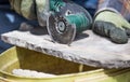 Worker cutting roof tiles with circular saw machine Royalty Free Stock Photo