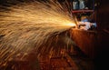 Worker cutting steel with acetylene welding cutting torch