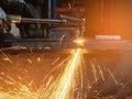 Worker cutting steel with acetylene welding cutting