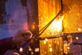 Worker cutting steel board using metal torch Royalty Free Stock Photo