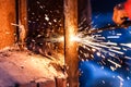 Worker cutting steel board using metal torch Royalty Free Stock Photo