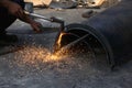 Worker cutting steel with oxyacetylene