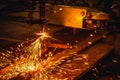 Worker cutting steel plate with acetylene welding cutting torch