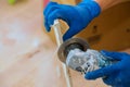 Worker cutting a tile using grinder at construction trimming tiles