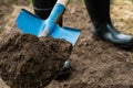 Worker digs the black soil with shovel in the vegetable garden Royalty Free Stock Photo