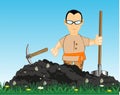 Worker digs land with shovel and pickax