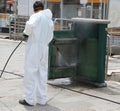 Worker during the disinfestation of street furniture during the