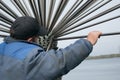 Sicheslavskaya Embankment, Dnepropetrovsk, Ukraine - 10/21/2020: A worker dismantles the city fountain for the winter. Working
