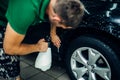 Worker disperses soapy water, paint protection Royalty Free Stock Photo