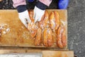 Worker does salting and drying grey mullet roe