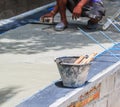 Worker does smooth the plasterer concrete