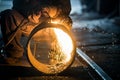 Worker doing a industrial welding in a workshop Royalty Free Stock Photo