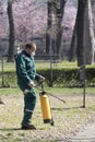 Worker doing park disinfection spraying for prevention of Corona virus spreading