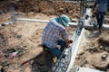 Worker doing the steelwork for reinforcement of the concrete str