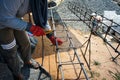 Worker doing the steelwork for reinforcement of the concrete structure.