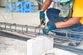 Worker doing the steelwork for reinforcement of concrete structure