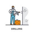 Worker drills a wall.