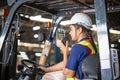 Worker driver at warehouse forklift loader works, Female worker on forklift, Manual workers working in warehouse Royalty Free Stock Photo