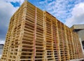 Worker driving forklift loading shipment carton boxes goods on wooden pallet at loading dock from container truck to warehouse car Royalty Free Stock Photo