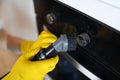 Worker dusting stove