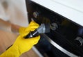 Worker dusting stove