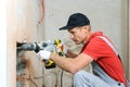 Worker with an electric hammer.