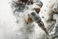 Worker skillfully demolishing a wall with a jackhammer, creating a cloud of concrete dust in a professional setting Royalty Free Stock Photo