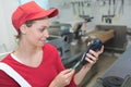 Worker entering pin code to bank terminal with credit car