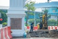 worker, excavator, Singapore street rennovation Royalty Free Stock Photo