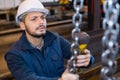 Worker in factory with hand lift