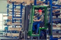 Worker in factory in lift truck with thumb up