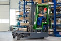 Worker in factory in lift truck with thumb up