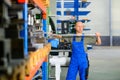 Worker in factory in stockroom