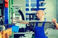 Worker in factory in stockroom