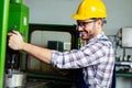 Worker in factory using drill machine Royalty Free Stock Photo