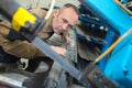 Worker in factory working on metalworks machine Royalty Free Stock Photo