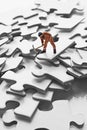 Worker figurine on puzzle pieces Royalty Free Stock Photo