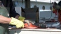 A worker fillets a fresh caught salmon for a customer in Valdez Alaska