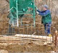 Worker filling concrete