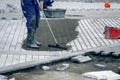 Worker filling the paver joints 2