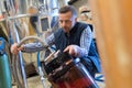 Worker filling tank in factory